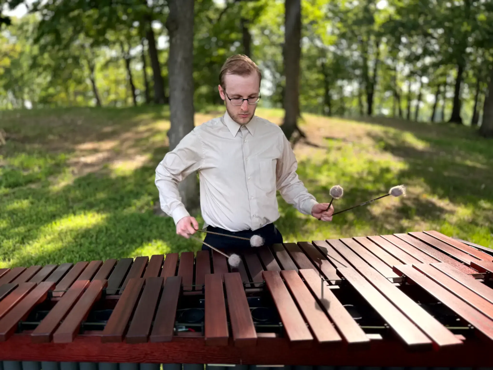 Spencer Perilloux performing solo marimba outdoors.
