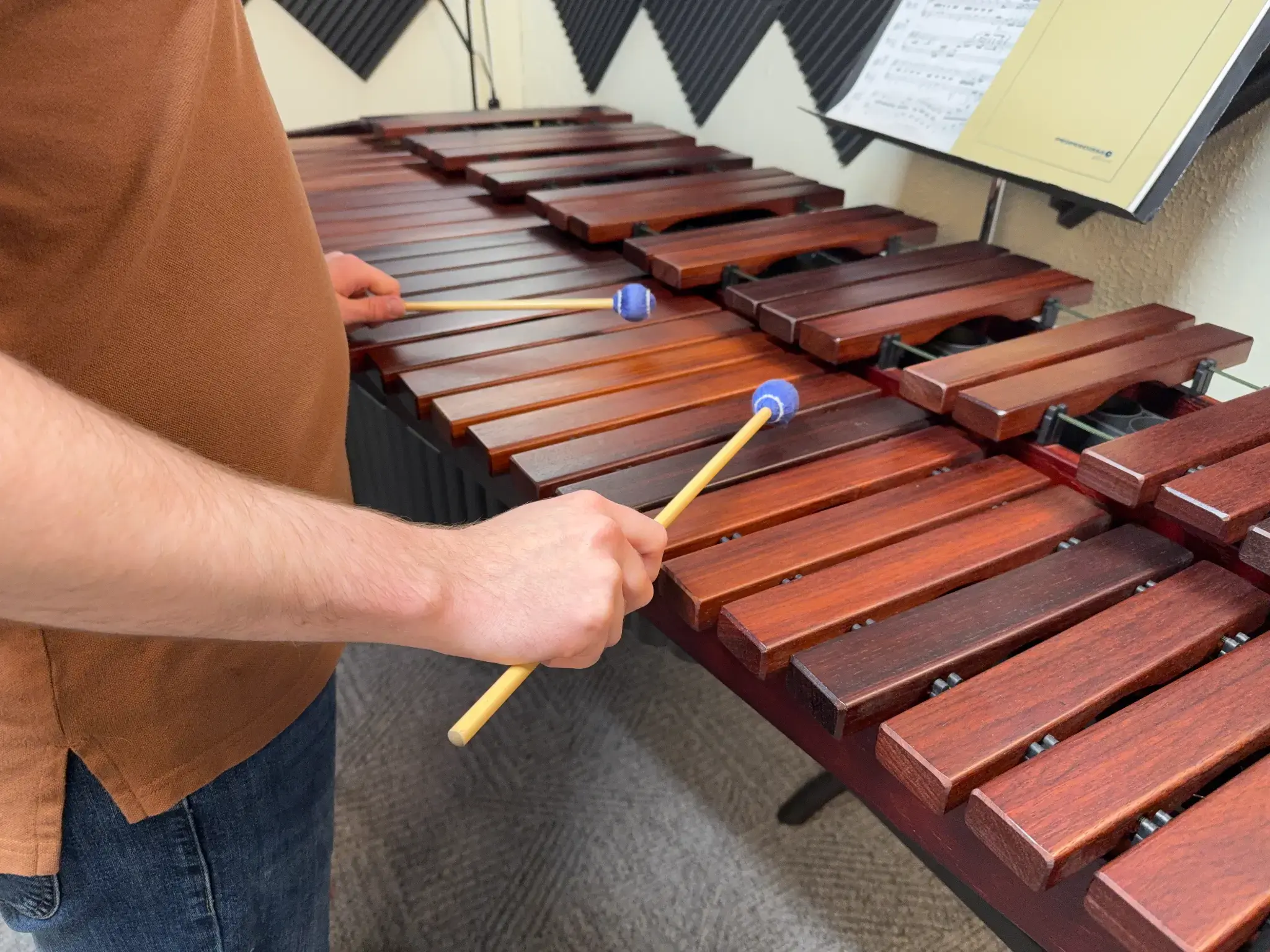 Close view of mallet technique on a marimba.
