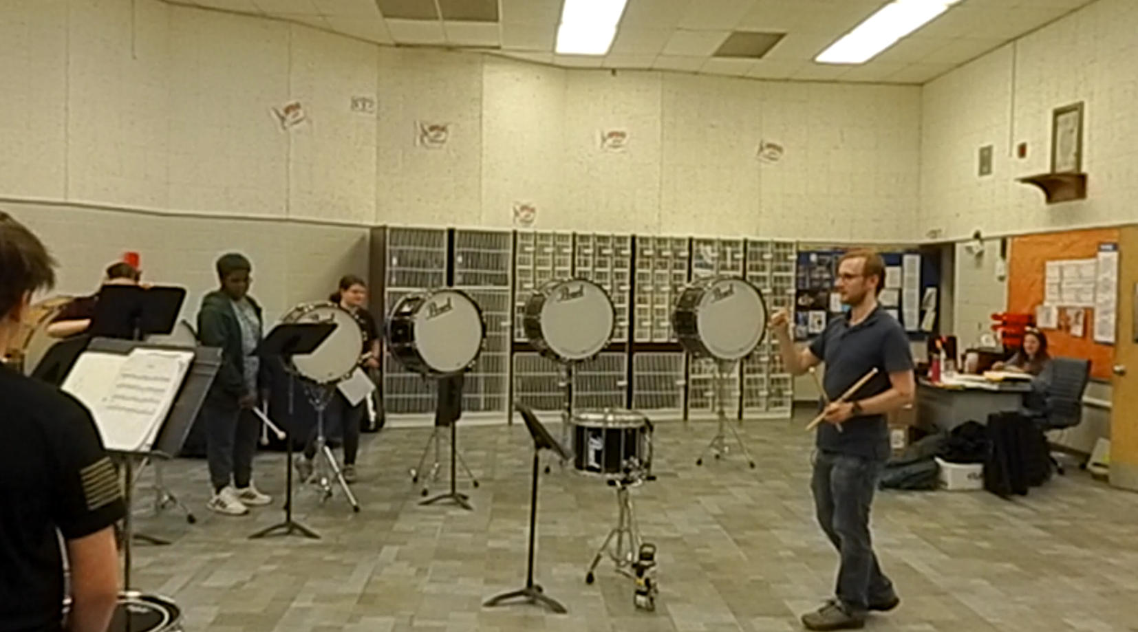 Spencer Perilloux teaching a school percussion clinic.