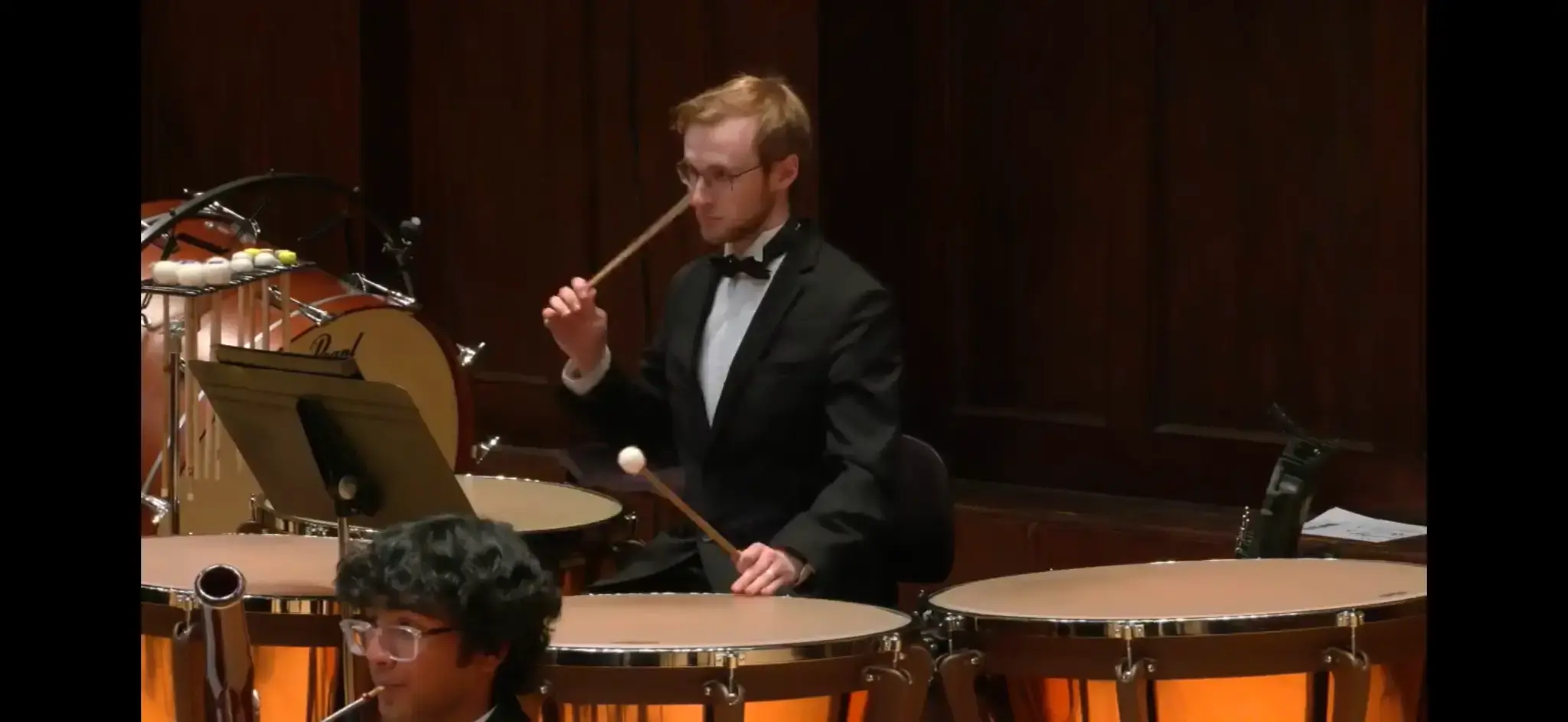 Spencer Perilloux performing timpani in an orchestral setting.