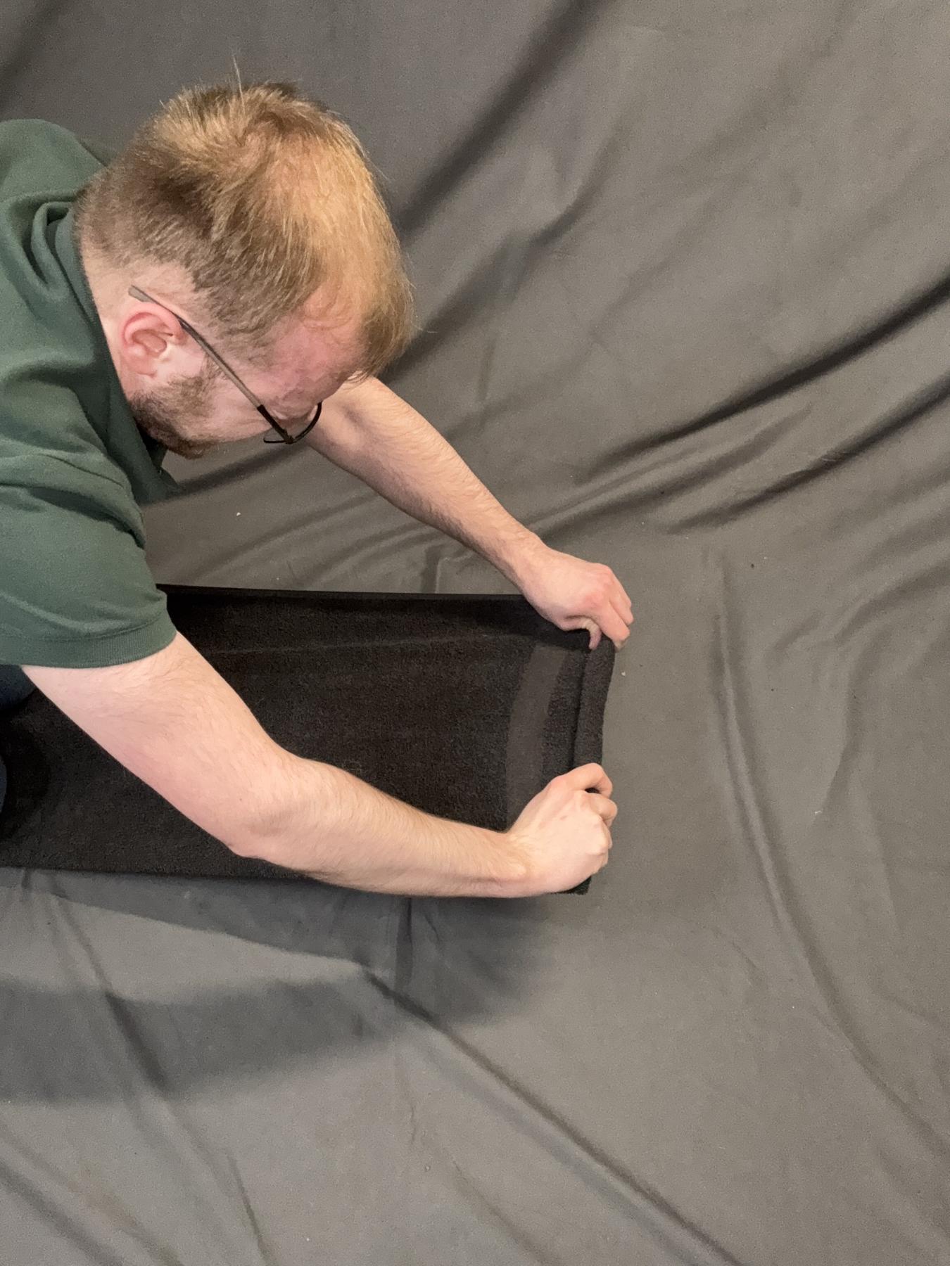 The first tight fold of the towel roll.