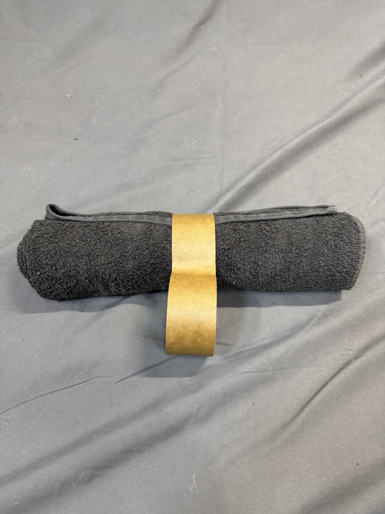 Tape wrapped around the center of the towel roll.