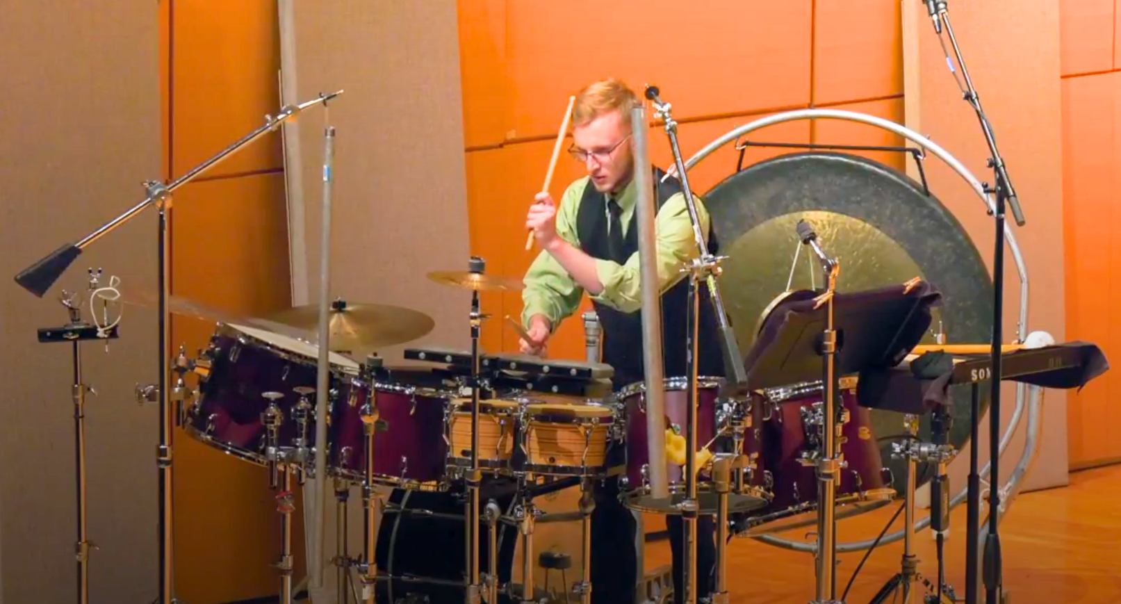 Spencer Perilloux performing at a multi-percussion setup.